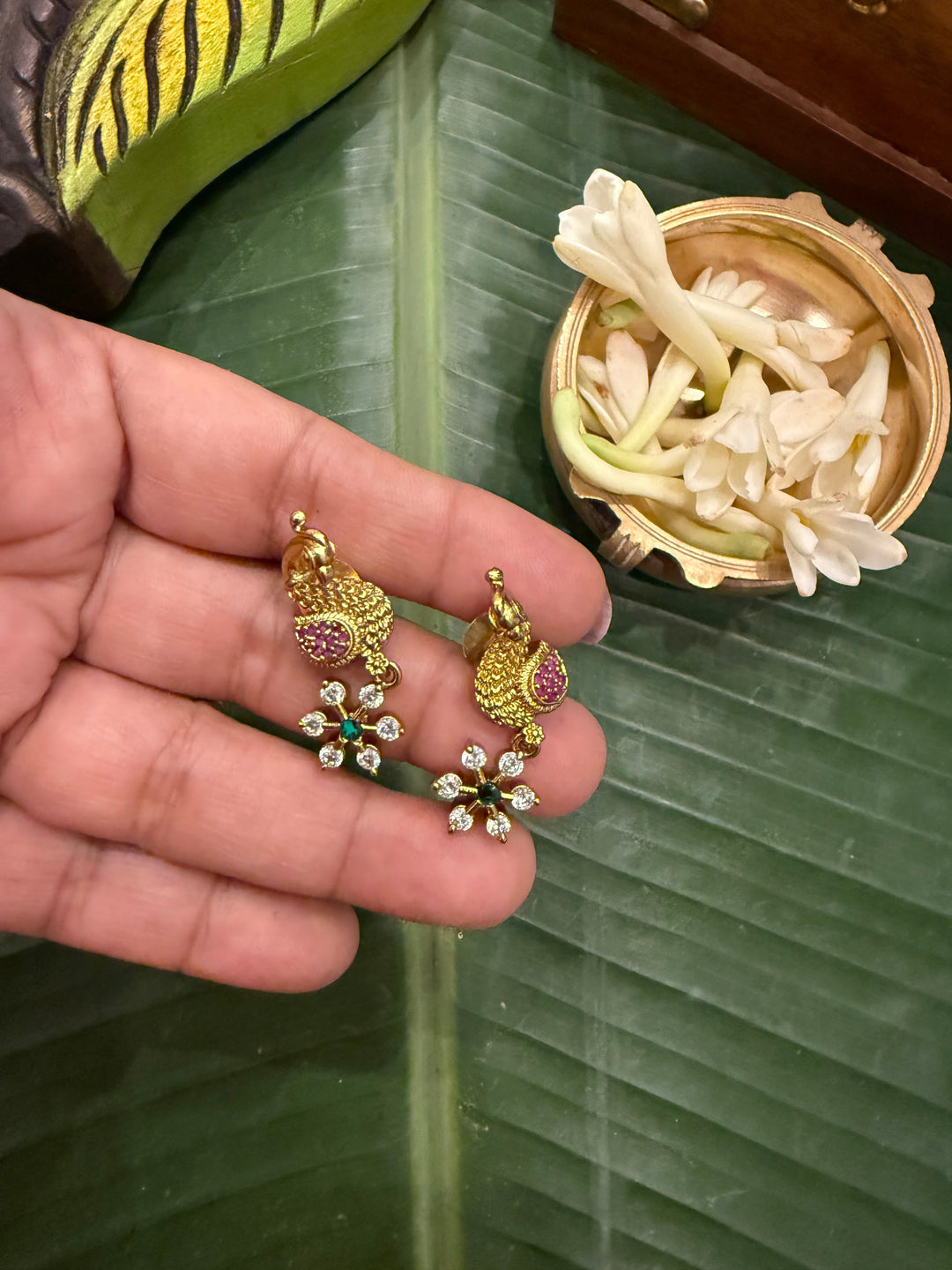 Divine Elegance , A traditional Necklace with a Mahalakshmi Pendant in red green and white stones with peacock detailing