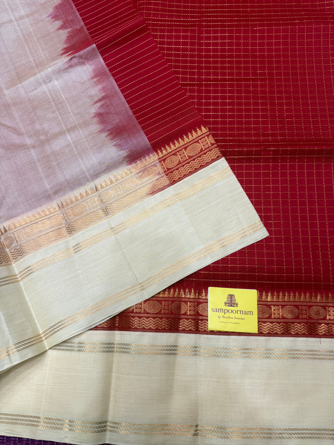 Classic Red with Offwhite , Rich Zari checks in the body , rettapet borders and rich Pallu Korvai Silk Cotton Saree