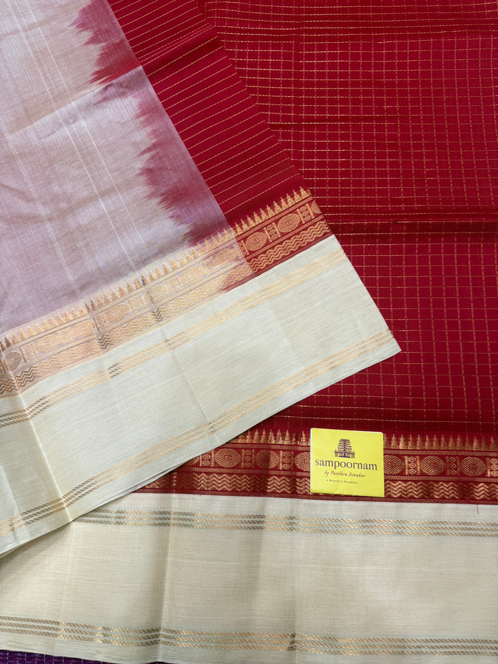 Classic Red with Offwhite , Rich Zari checks in the body , rettapet borders and rich Pallu Korvai Silk Cotton Saree