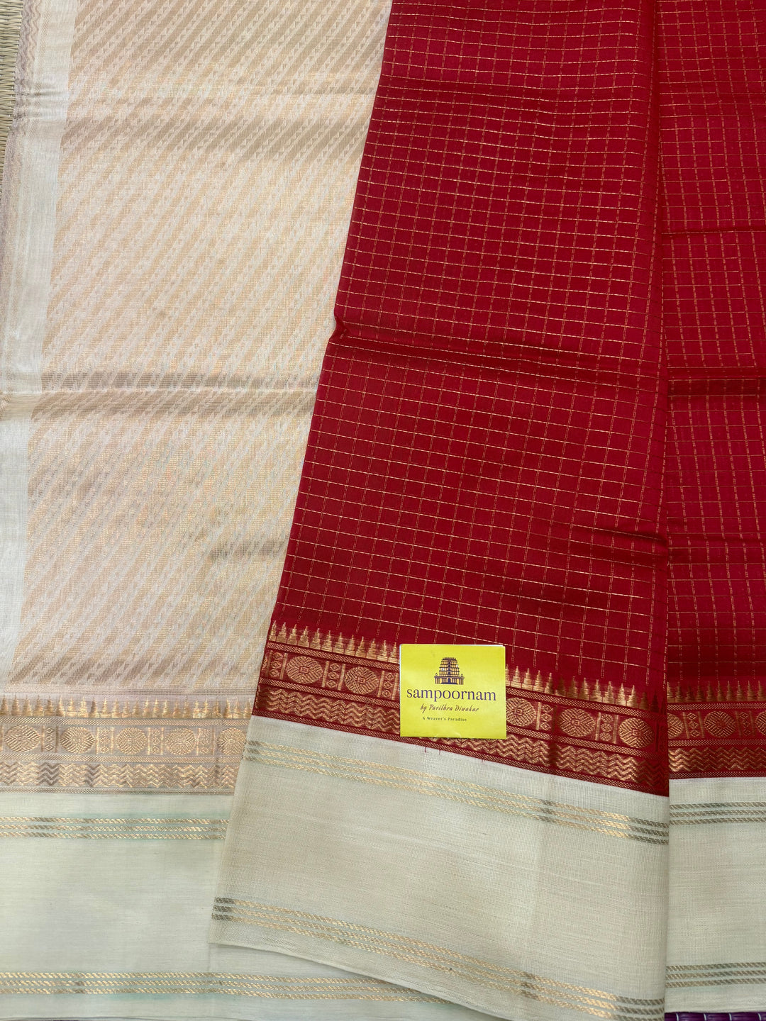 Classic Red with Offwhite , Rich Zari checks in the body , rettapet borders and rich Pallu Korvai Silk Cotton Saree