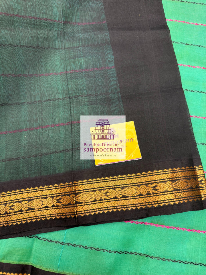 Ramar Green with Black  , traditional borders with Veldhari lines in the body and grand Pallu Korvai Silk Cotton Saree