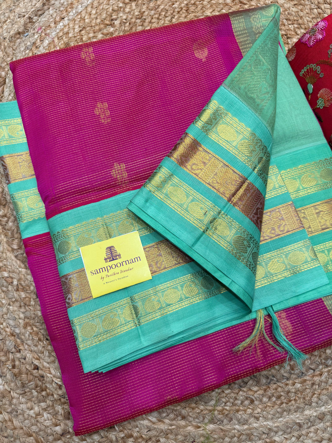 Rani Pink with Sea Green , Rich Zari checks and Butta in the body , Kanchi  borders and rich Pallu Korvai Silk Cotton Saree