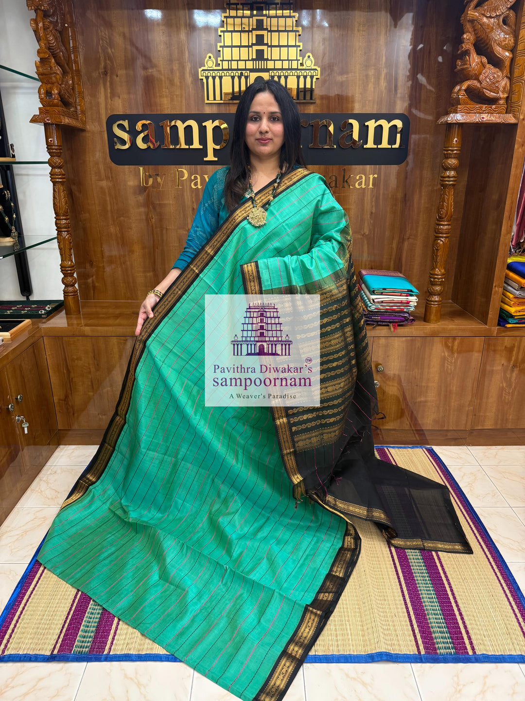 Ramar Green with Black  , traditional borders with Veldhari lines in the body and grand Pallu Korvai Silk Cotton Saree