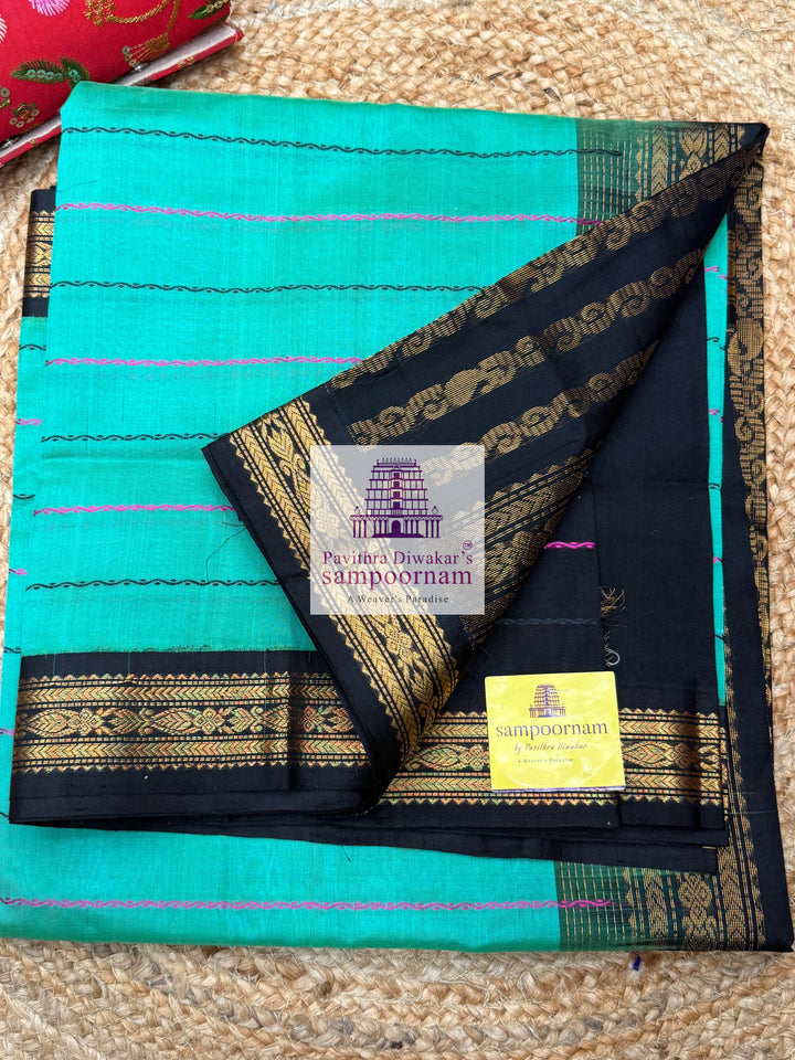 Ramar Green with Black  , traditional borders with Veldhari lines in the body and grand Pallu Korvai Silk Cotton Saree
