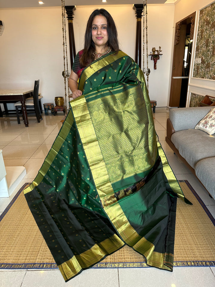 Dark Green with Zari Butta all over the Body Rich Border And Pallu Pure Kanjivaram Silk Saree