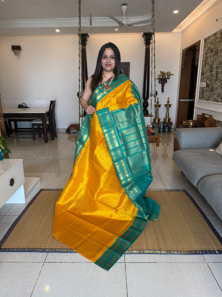 Yellow with Turquoise Blue , rettapet traditional border , Zari checks in the body and rich Pallu Korvai Silk Cotton Saree