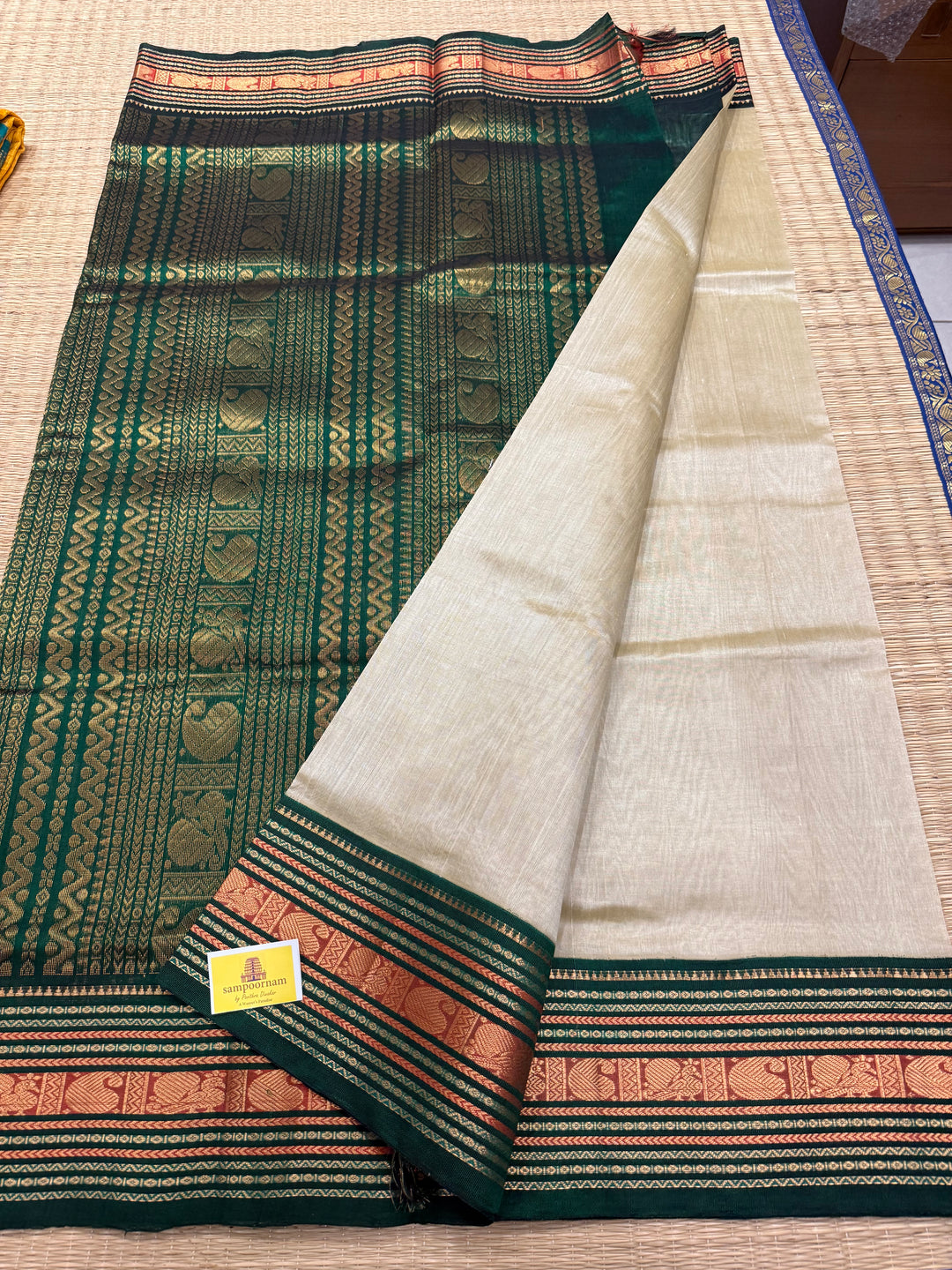 Offwhite with Green rich Kanchi border and grand  Pallu Korvai Silk Cotton Saree
