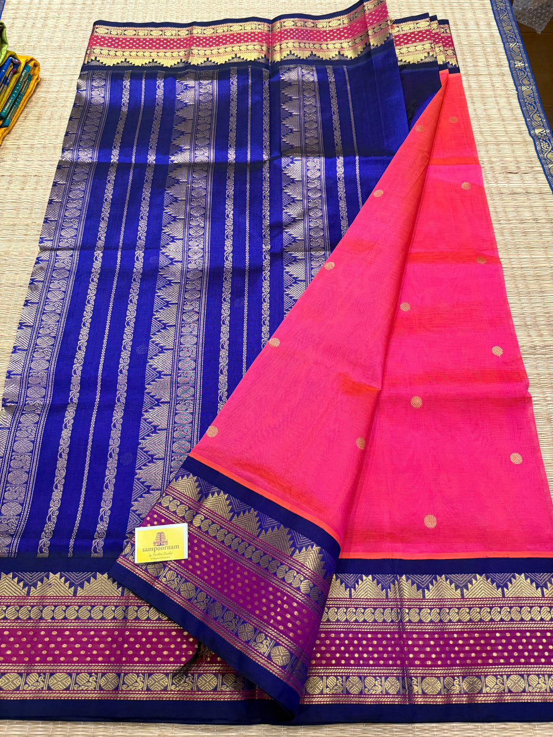 Magenta with Blue , rettapet border with Lakshadeepam butta , rich butta in the body and grand Pallu Korvai Silk Cotton Saree