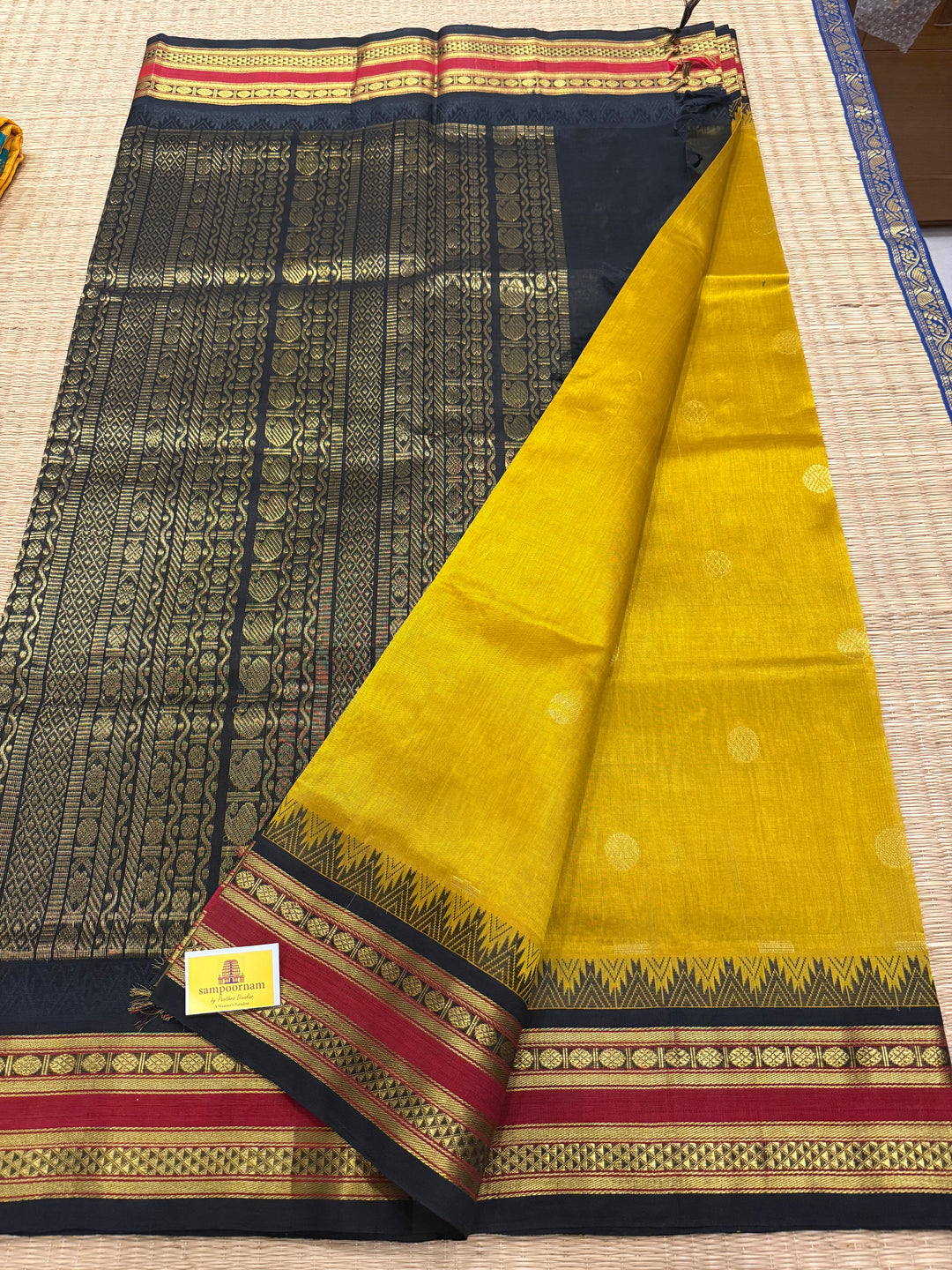 Mustard with Black ,rich Zari butta in the body , traditional rettapet temple thread borders and grand Pallu Korvai Silk Cotton Saree
