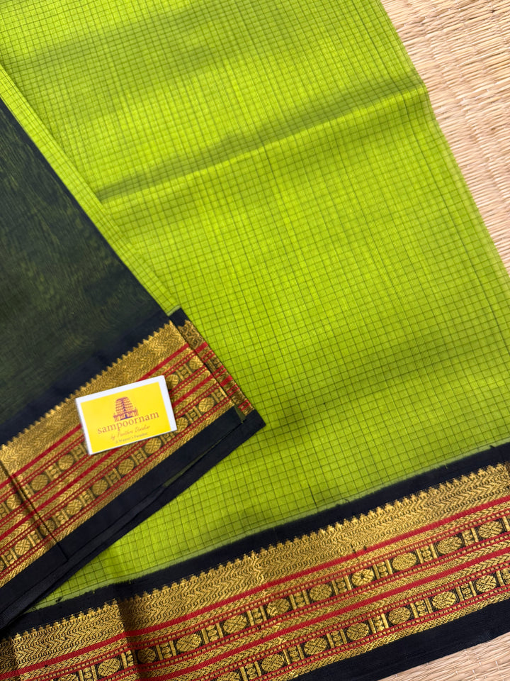 Leaf Green with Black , checks in the body , traditional borders and rich Pallu Korvai Silk Cotton Saree