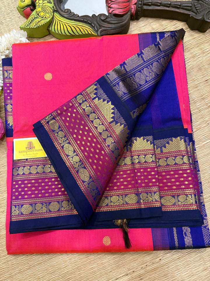 Magenta with Blue , rettapet border with Lakshadeepam butta , rich butta in the body and grand Pallu Korvai Silk Cotton Saree