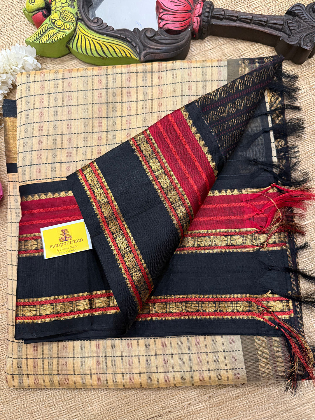Biscuit and Black , Lakshadeepam Zari butta in the body and rettapet traditional borders and rich Pallu Korvai Silk Cotton Saree
