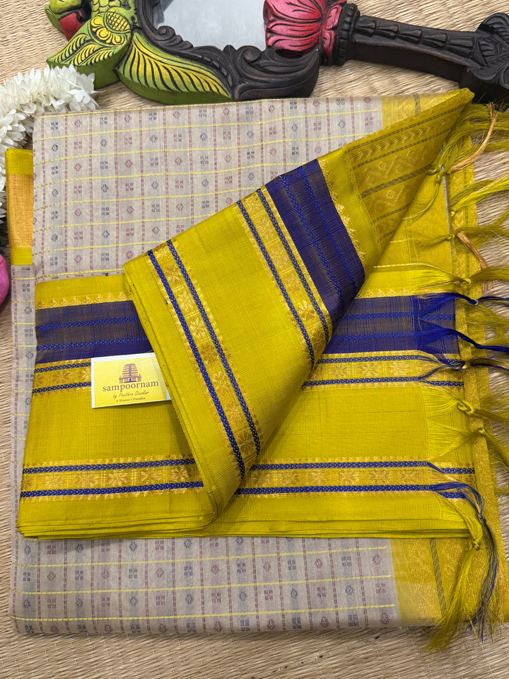 Offwhite with Lemon Yellow , Lakshadeepam Zari butta in the body and rettapet traditional borders and rich Pallu Korvai Silk Cotton Saree