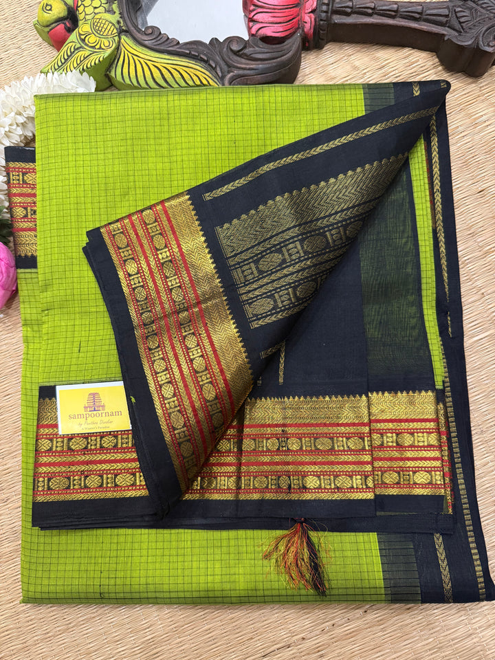 Leaf Green with Black , checks in the body , traditional borders and rich Pallu Korvai Silk Cotton Saree