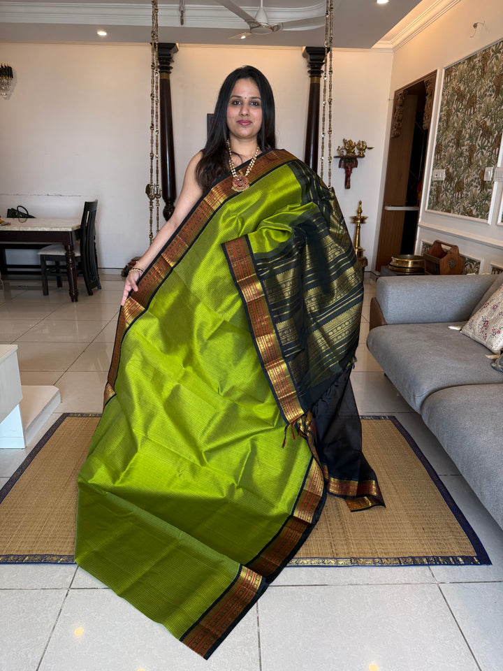 Leaf Green with Black , checks in the body , traditional borders and rich Pallu Korvai Silk Cotton Saree