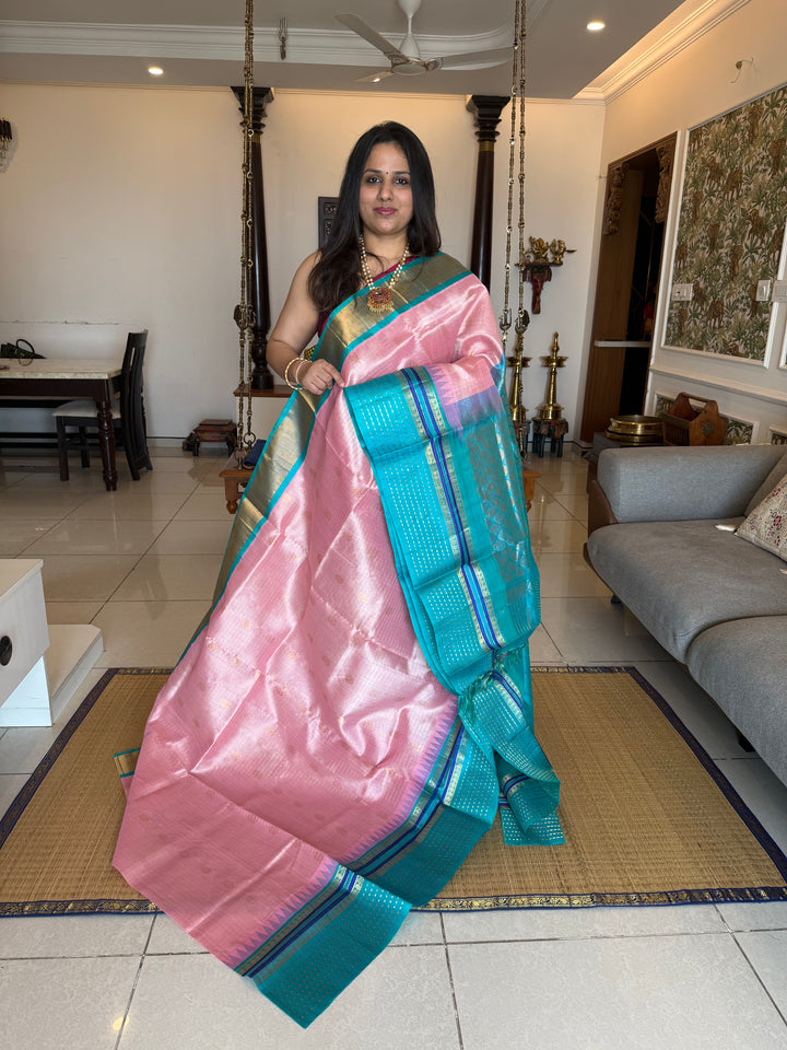 Baby Pink with Turquoise Blue one side big border with Lakshadeepam butta , Zari butta in the body with Zari checks and grand Pallu Korvai Silk Cotton Saree