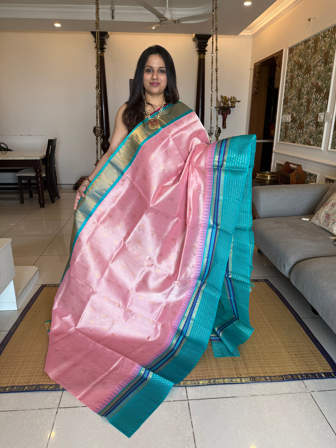 Baby Pink with Turquoise Blue one side big border with Lakshadeepam butta , Zari butta in the body with Zari checks and grand Pallu Korvai Silk Cotton Saree
