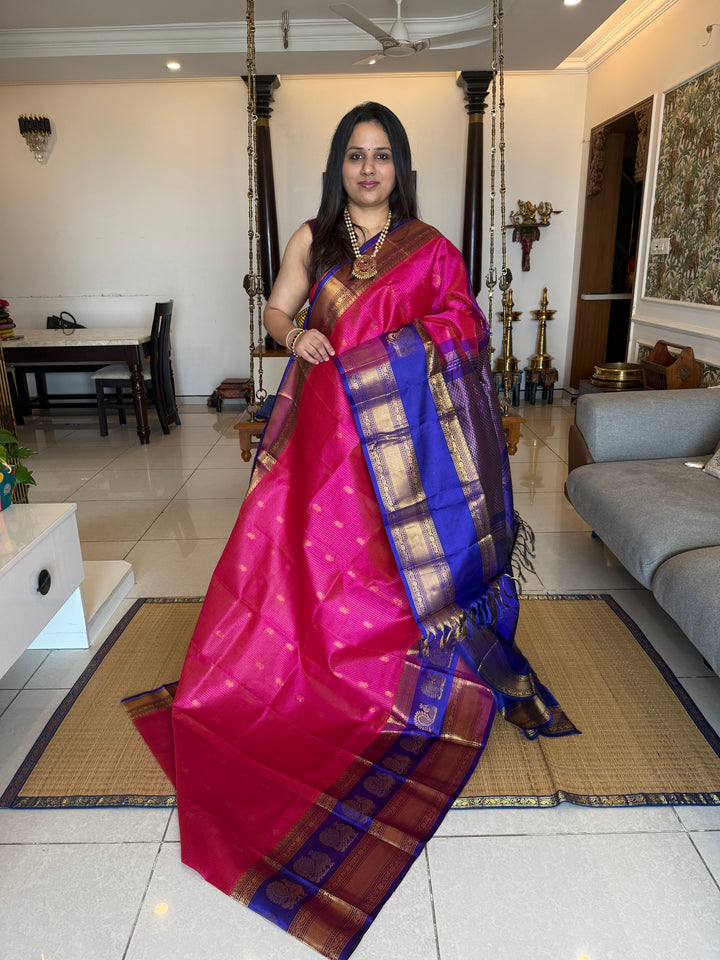 Magenta with Blue , rich Zari Podi Kattam with butta in the body , traditional one side satin big border with Annam butta and grand Pallu Korvai Silk Cotton Saree
