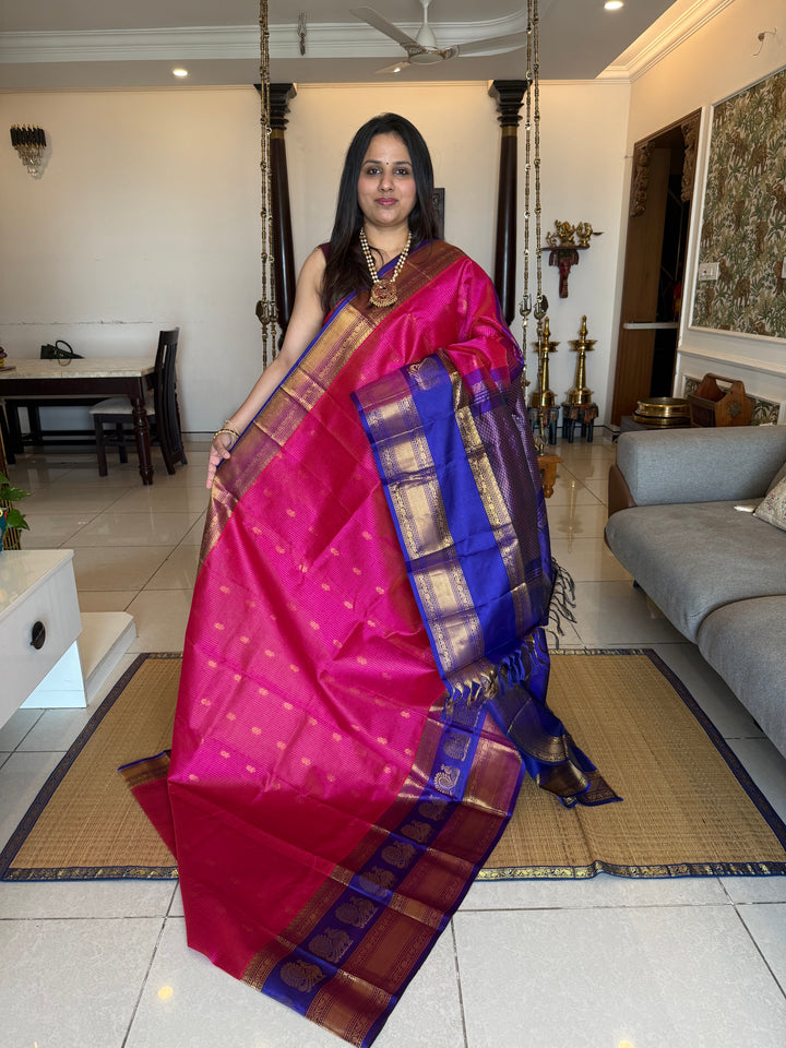 Magenta with Blue , rich Zari Podi Kattam with butta in the body , traditional one side satin big border with Annam butta and grand Pallu Korvai Silk Cotton Saree