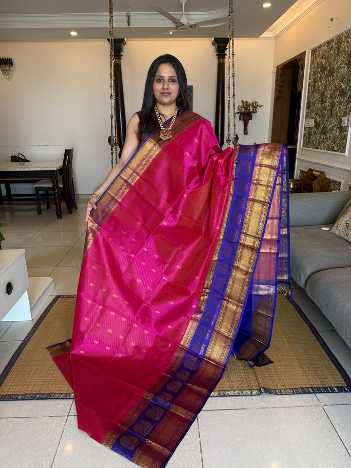 Magenta with Blue , rich Zari Podi Kattam with butta in the body , traditional one side satin big border with Annam butta and grand Pallu Korvai Silk Cotton Saree