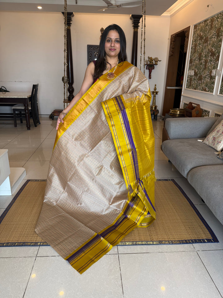 Offwhite with Lemon Yellow , Lakshadeepam Zari butta in the body and rettapet traditional borders and rich Pallu Korvai Silk Cotton Saree