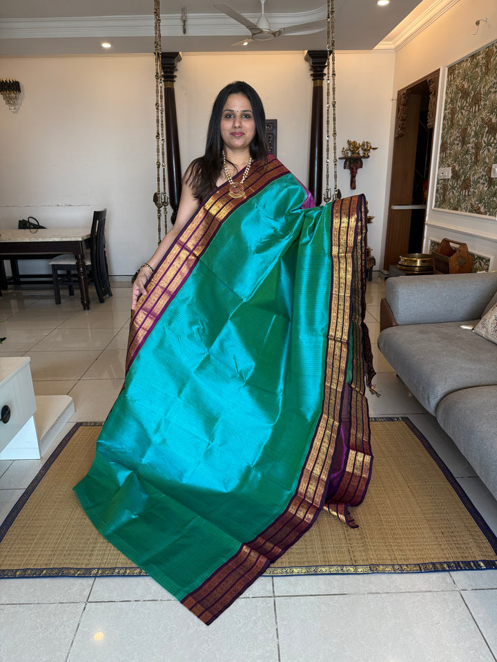 Ramar Blue with Purple , Zari checks in the body with traditional Kanjivaram borders and rich Pallu Korvai Silk Cotton Saree