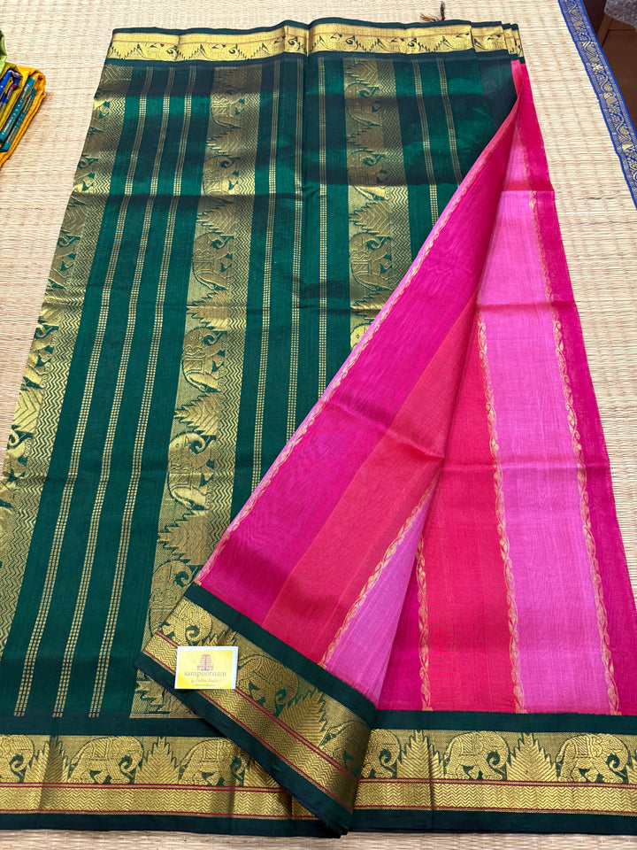 A Fusion of Colours Magenta and Pink with Green and Vertical Zari lines in the body with traditional borders and rich Pallu Korvai Silk Cotton Saree