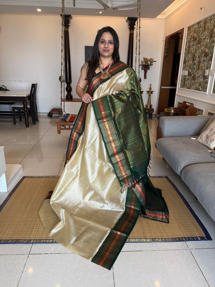 Offwhite with Green rich Kanchi border and grand  Pallu Korvai Silk Cotton Saree