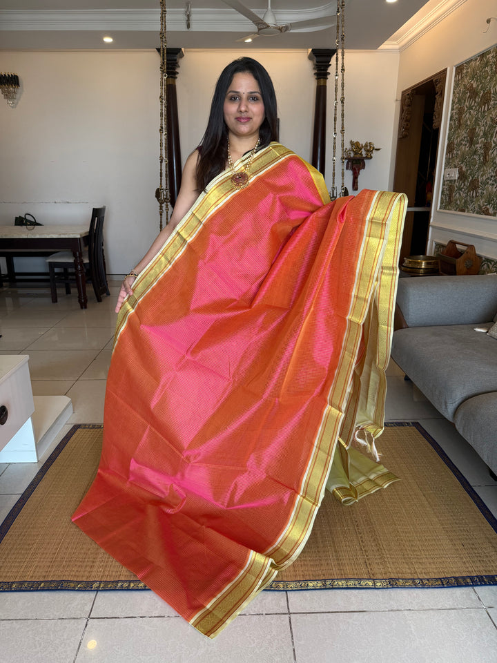 Pink with Pastel Yellow and Offwhite traditional border , checks in the body and grand Pallu Korvai Silk Cotton Saree