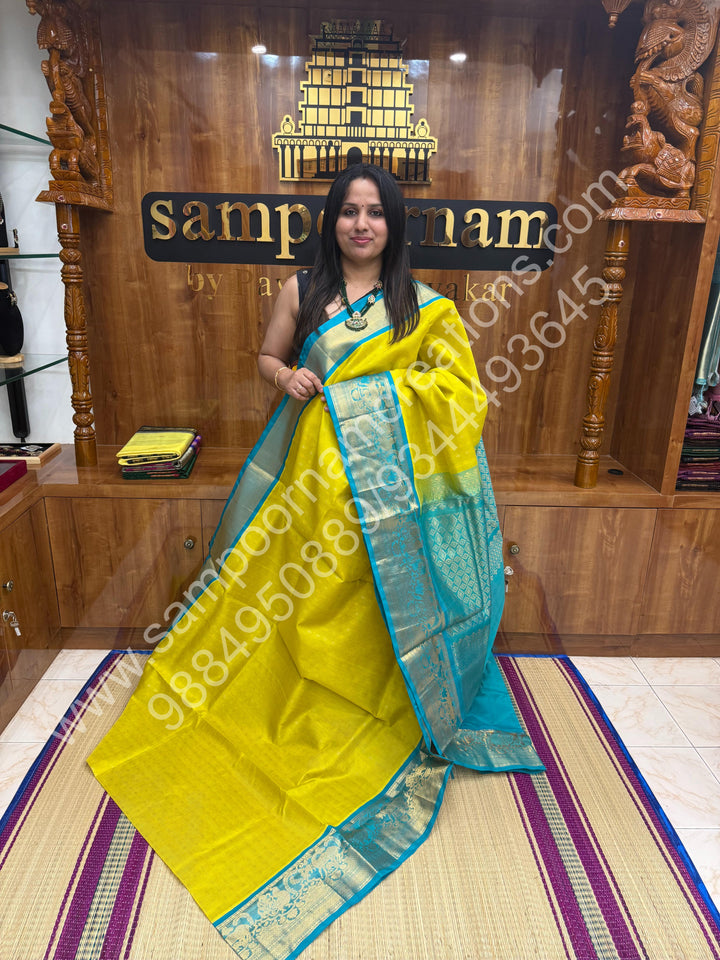 Lemon Yellow with Turquoise Blue  , rich Zari butta and Podi Kattam in the body ,traditional one side long  Borders and Grand Pallu Korvai Silk Cotton Saree
