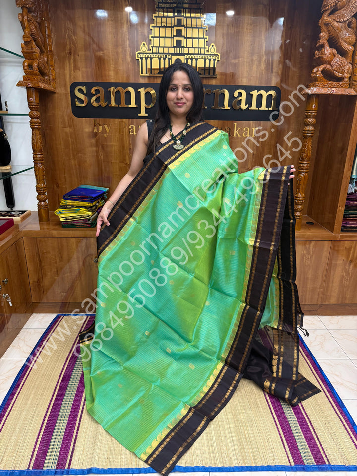 Sea Green Gold with Dark Brown , Zari checks , Mayil and Chakram rich butta in the body , rich borders with traditional Pallu Korvai Silk Cotton Saree