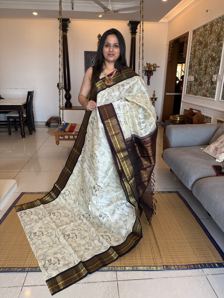 Offwhite with Brown traditional borders and  rich Pallu , Pichwai outline printed Korvai Silk Cotton Saree