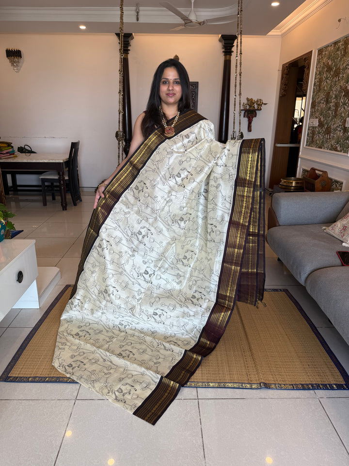 Offwhite with Brown traditional borders and  rich Pallu , Pichwai outline printed Korvai Silk Cotton Saree