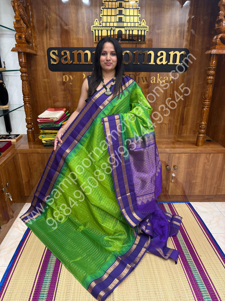 Leaf Green with Indigo Blue  , rich Zari checks in the body , Temple designs with Rettapet Borders and Grand Pallu Korvai Silk Cotton Saree