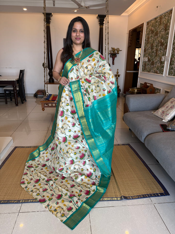 Offwhite with Turquoise traditional borders and rich Pallu , Pichwai printed Korvai Silk Cotton Saree