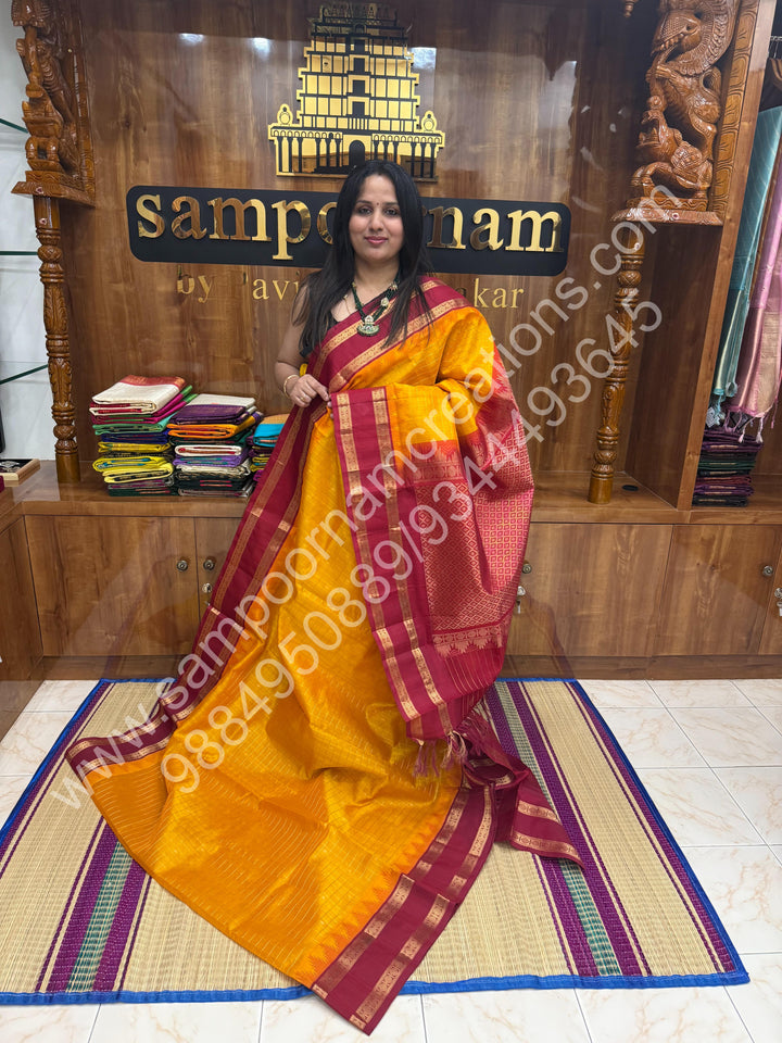 Mambazha Manjal with Red  , rich Zari checks in the body , Temple designs with Rettapet Borders and Grand Pallu Korvai Silk Cotton Saree