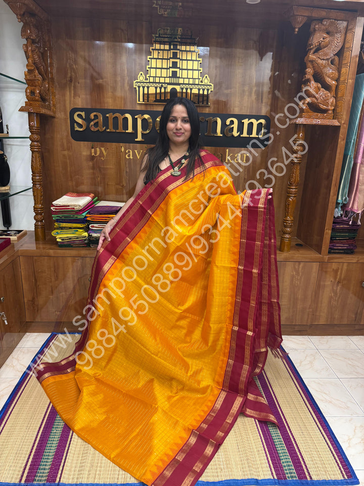 Mambazha Manjal with Red  , rich Zari checks in the body , Temple designs with Rettapet Borders and Grand Pallu Korvai Silk Cotton Saree