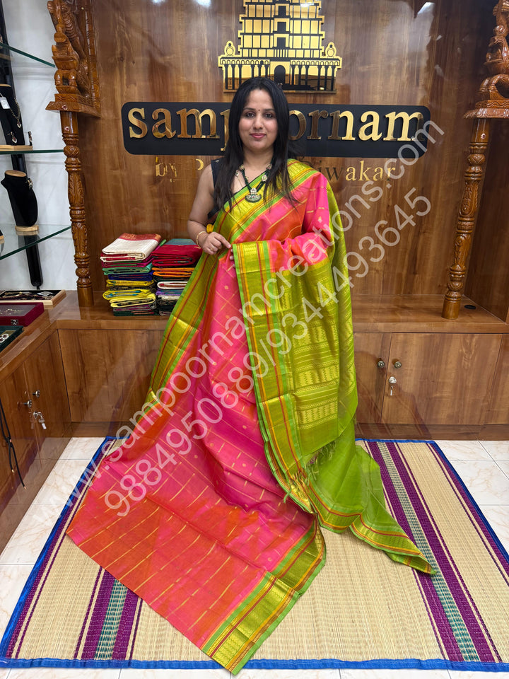 Candy Pink with Lemon Green  , rich Zari checks and Butta in the in the body , traditional Borders and Grand Pallu Korvai Silk Cotton Saree