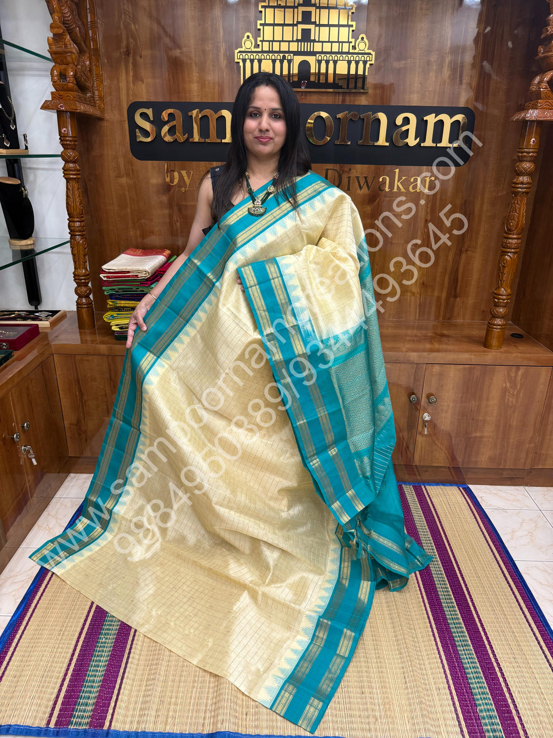 Offwhite with Turquoise Blue  , rich Zari checks in the body , Temple designs with Rettapet Borders and Grand Pallu Korvai Silk Cotton Saree