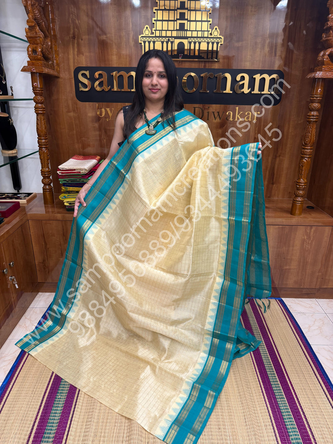 Offwhite with Turquoise Blue  , rich Zari checks in the body , Temple designs with Rettapet Borders and Grand Pallu Korvai Silk Cotton Saree