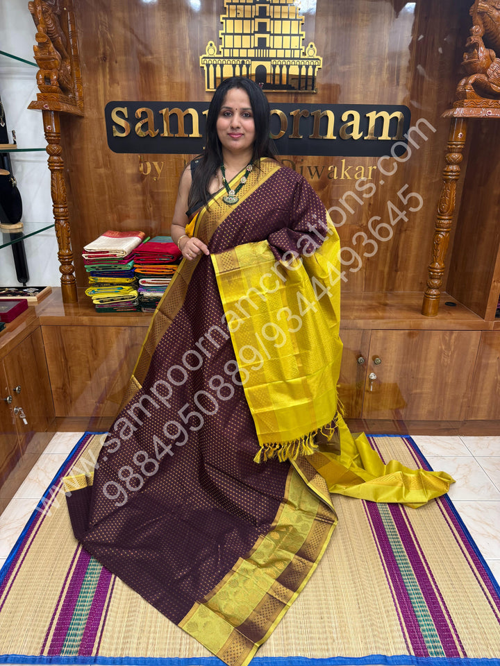 Brown with Lemon Yellow ,  , rich Zari butta in the body , one side big Satin Borders with Floral motif , traditional borders and Grand Pallu Korvai Silk Cotton Saree
