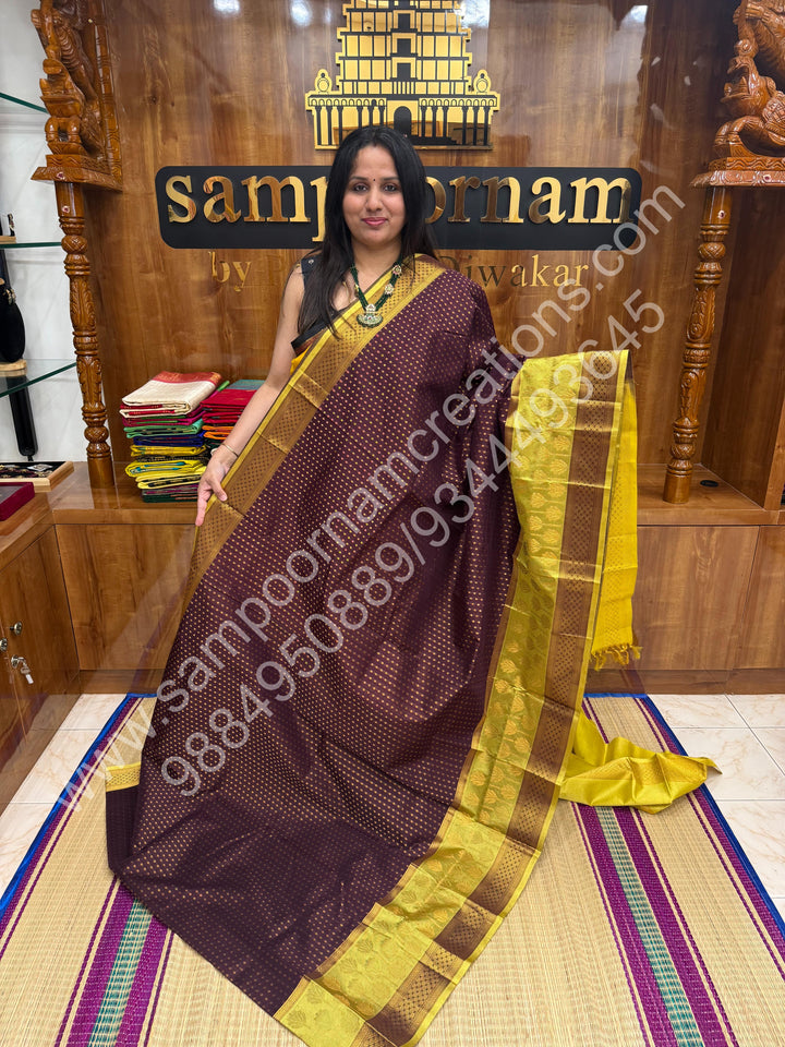 Brown with Lemon Yellow ,  , rich Zari butta in the body , one side big Satin Borders with Floral motif , traditional borders and Grand Pallu Korvai Silk Cotton Saree