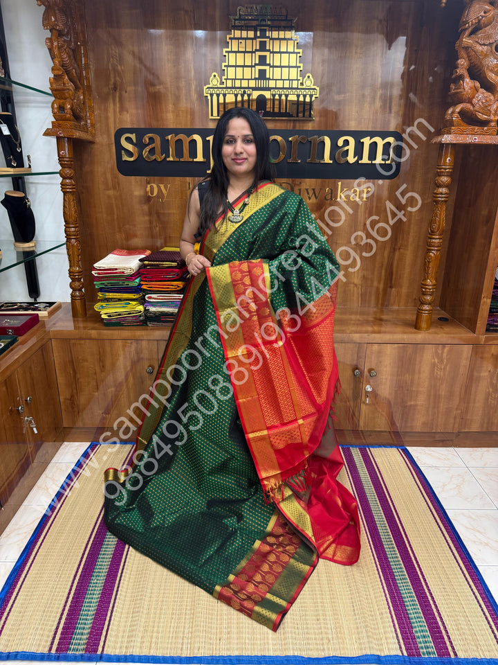 Green with Red  , rich Zari Lakshadeepam butta in the body , one side long traditional Borders and Grand Pallu Korvai Silk Cotton Saree