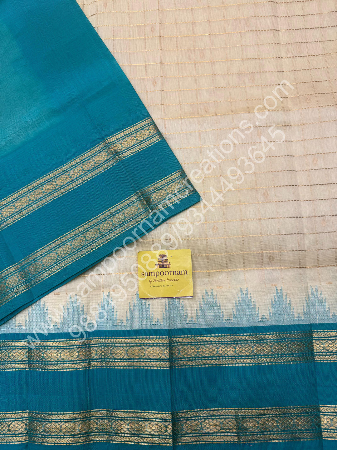 Offwhite with Turquoise Blue  , rich Zari checks in the body , Temple designs with Rettapet Borders and Grand Pallu Korvai Silk Cotton Saree