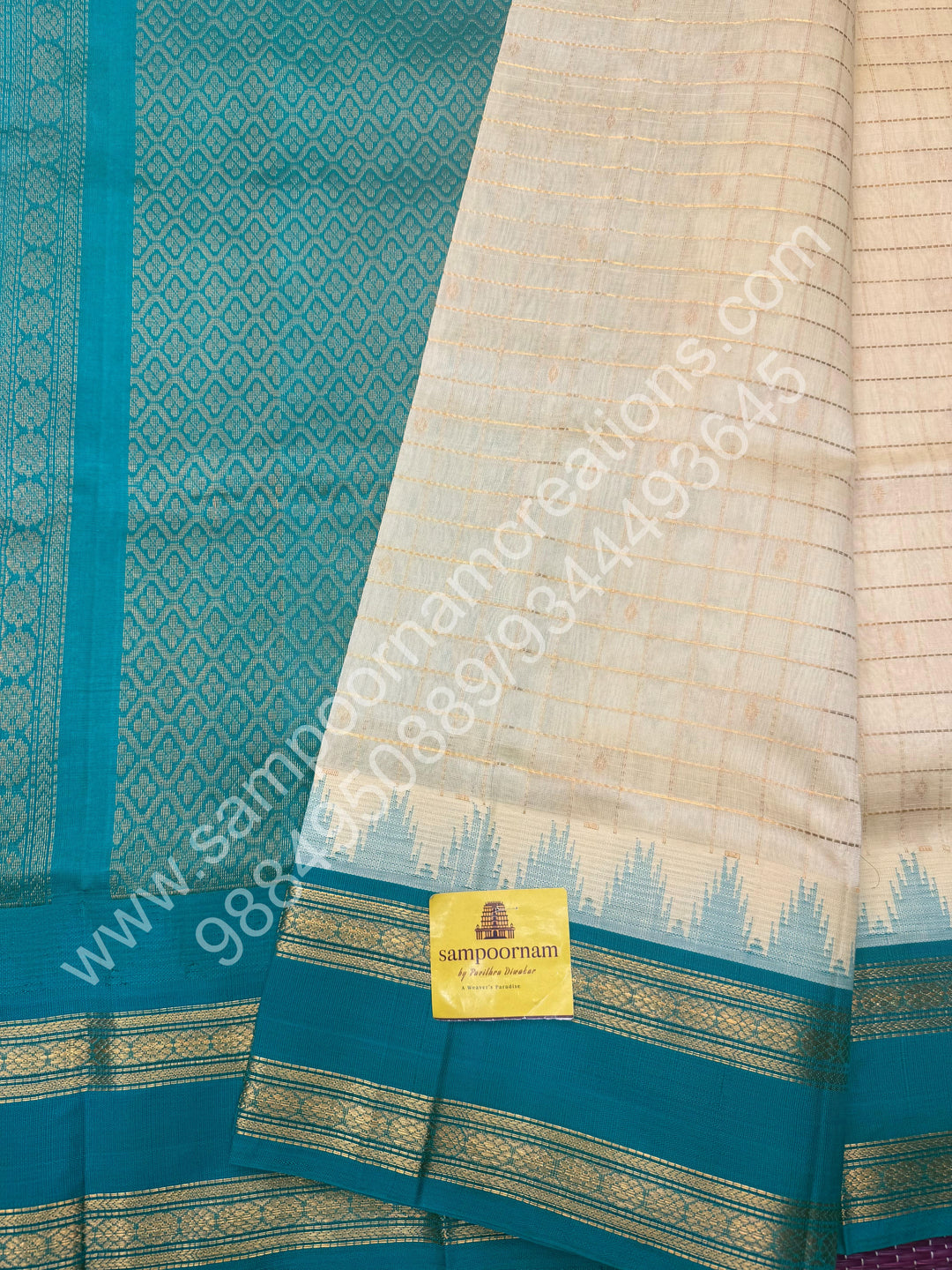 Offwhite with Turquoise Blue  , rich Zari checks in the body , Temple designs with Rettapet Borders and Grand Pallu Korvai Silk Cotton Saree