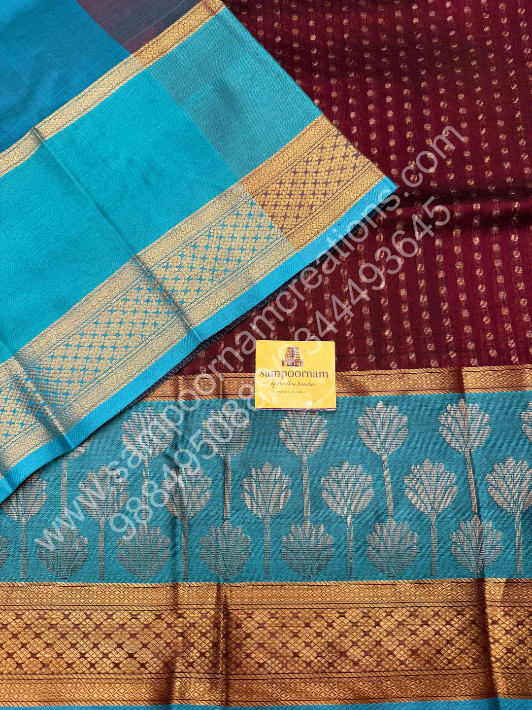 Maroon with Turquoise Blue  , rich Lakshadeepam butta in the body , one side long traditional Borders and Grand Pallu Korvai Silk Cotton Saree
