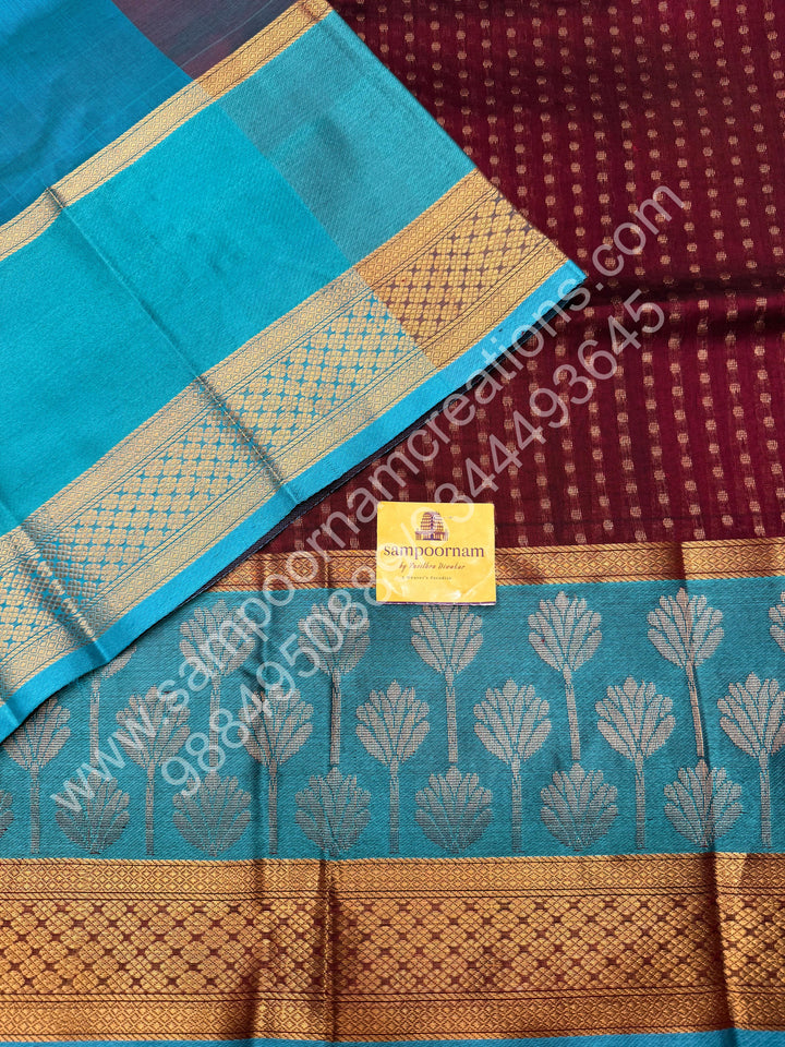 Maroon with Turquoise Blue  , rich Lakshadeepam butta in the body , one side long traditional Borders and Grand Pallu Korvai Silk Cotton Saree