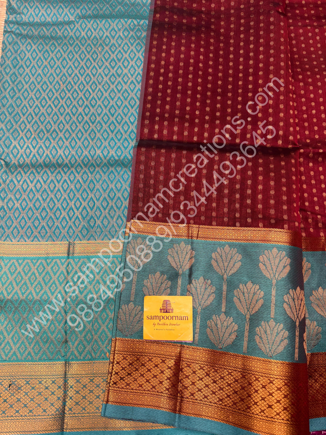 Maroon with Turquoise Blue  , rich Lakshadeepam butta in the body , one side long traditional Borders and Grand Pallu Korvai Silk Cotton Saree