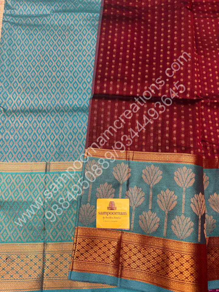 Maroon with Turquoise Blue  , rich Lakshadeepam butta in the body , one side long traditional Borders and Grand Pallu Korvai Silk Cotton Saree