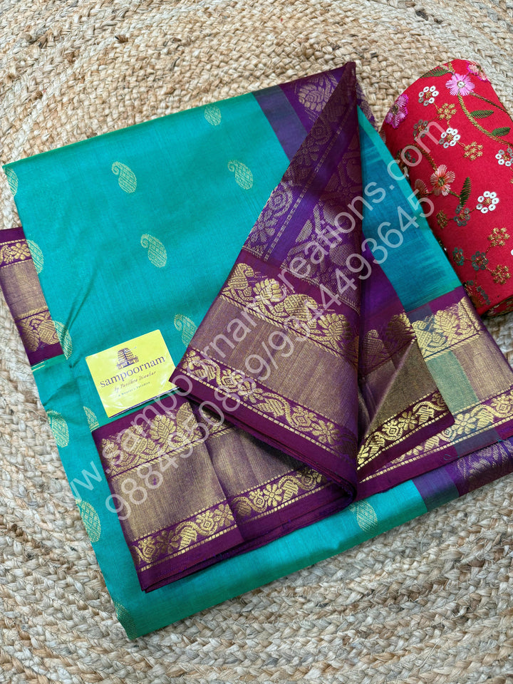 Double Shaded Ramar Green with Dark Maroon  , rich Zari Mango Butta in the body , Silk Borders and Grand Pallu Korvai Silk Cotton Saree